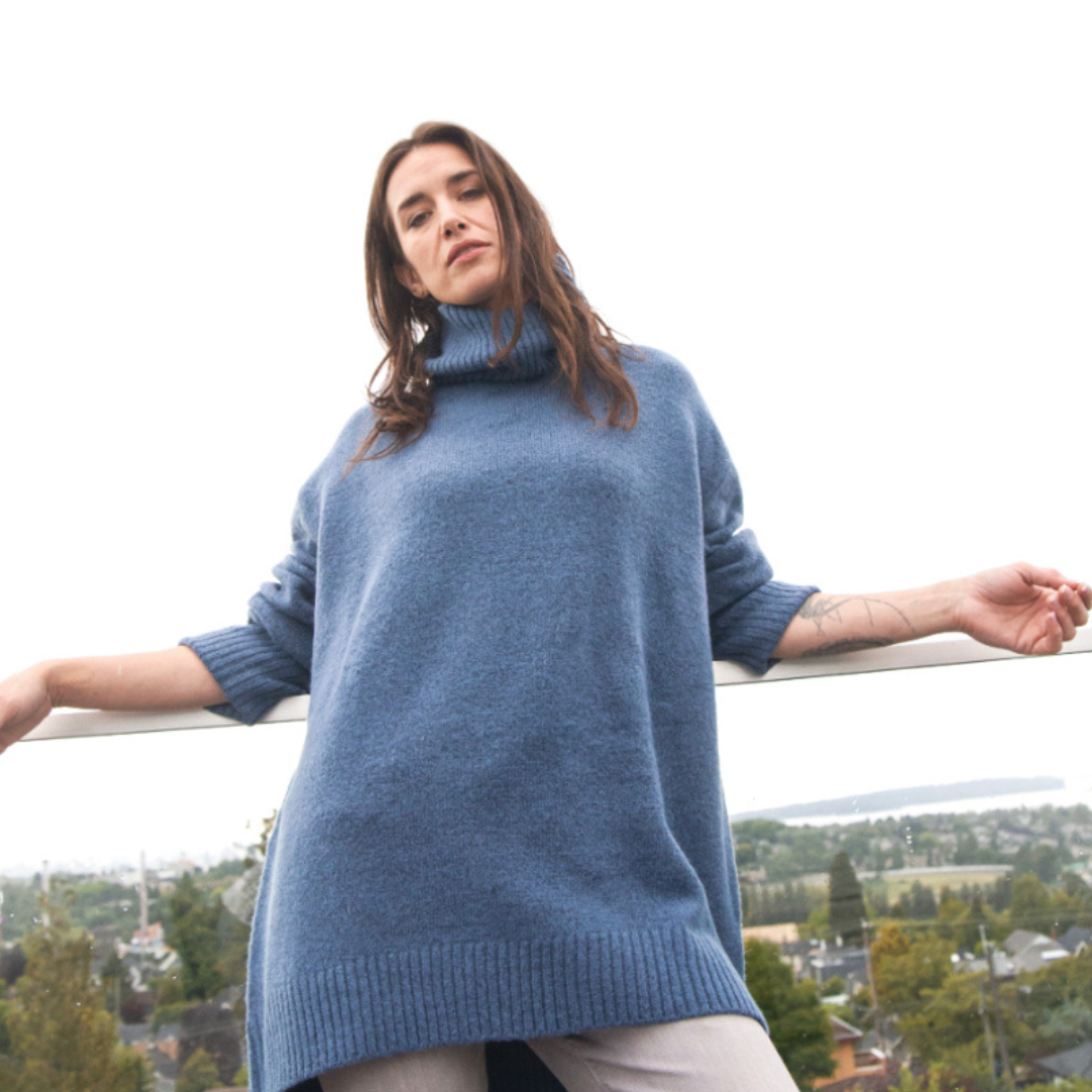 Hannah's Of Erin - Erin Ontario - Boutique - Echo Verde - Dog walker Sweater - Colour Denim. Cozy O/s Pullover, Cowl Neck, ribbed cowl, cuffs, hemline. Hi - Low Hemline. Our famous Dog Walker Sweater is back! A fall must-have in beautiful soft recycled yarns. Our number one best seller! Get yours before they sell out! Blend of Acrylic/Recycled Polyester/Spandex