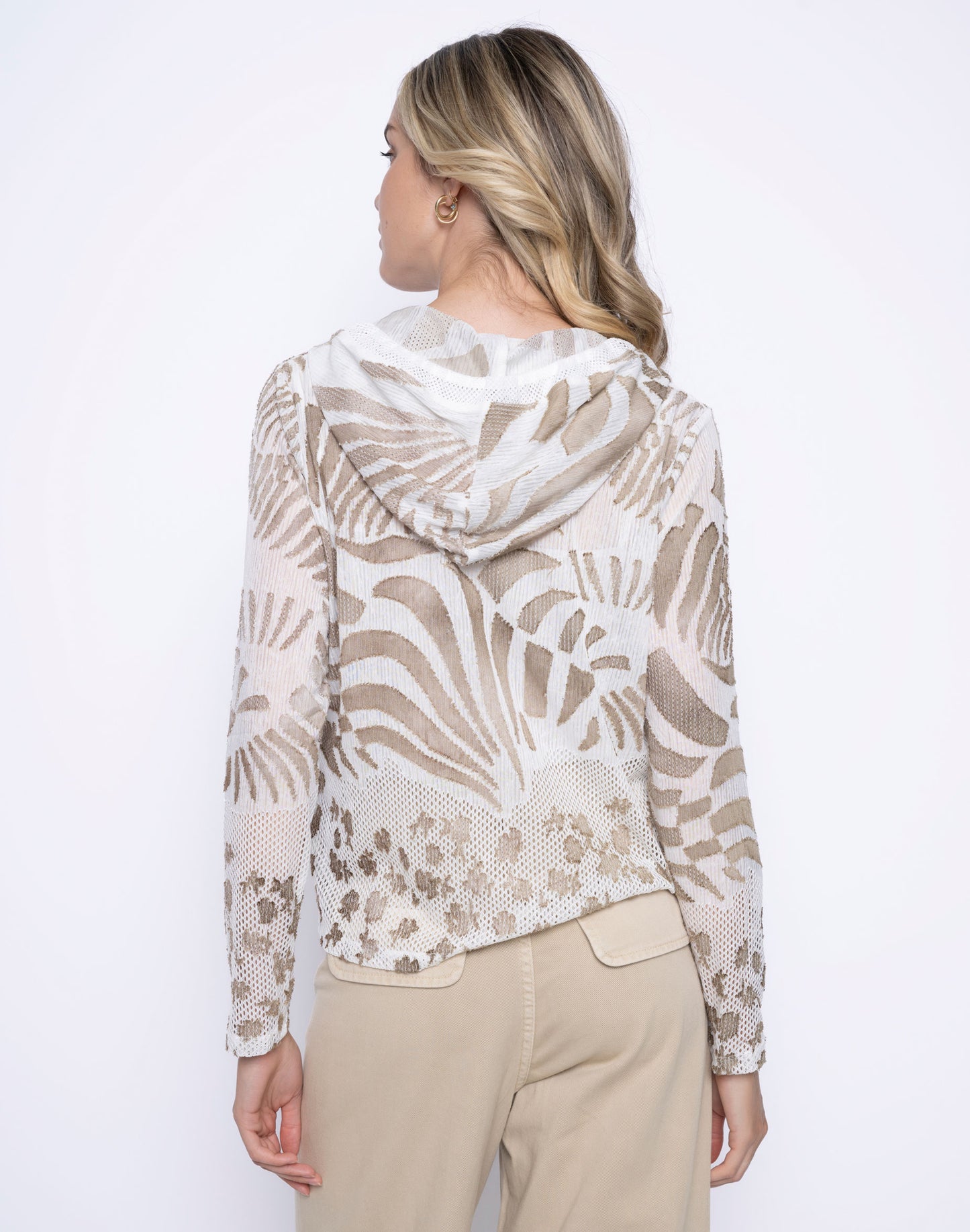 Hannahs Of Erin-Erin Ontario-Clothing Boutique-Zip Hooded Mesh Jacket-GC444JW. neutral tropical palm print in taupe and white. Features a zip-front closure, drawstring hood, long sleeves, and breathable mesh fabric. Lightweight and perfect for layering, travel, and casual wear. Pairs effortlessly with Picadilly wide-leg jeans in sand.