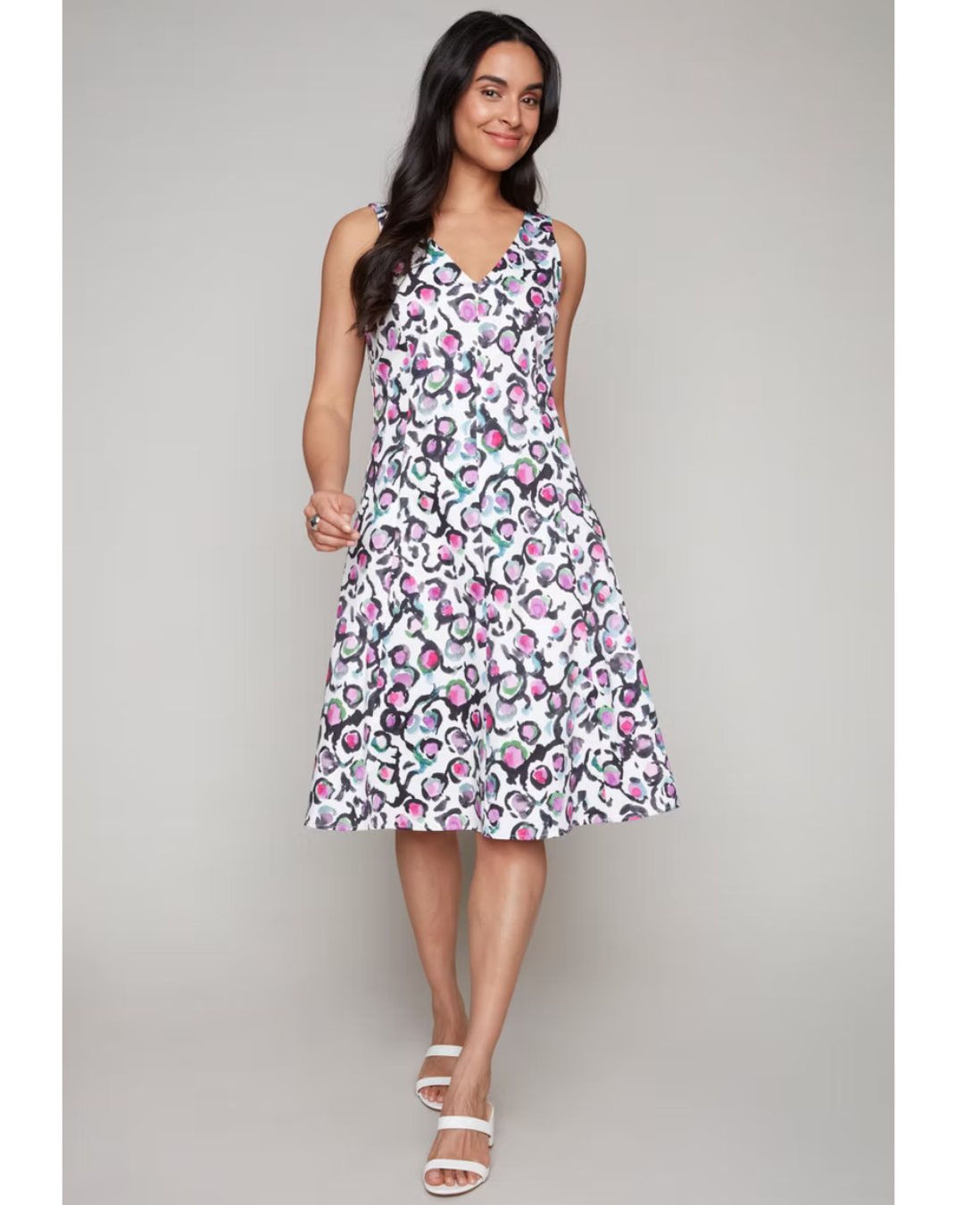Hannahs_Of_Erin-Erin_Ontario-Compli_K-A-lineDress Style 33910.
Sleeveless A-line dress with a V-neckline and knee-length hem. Features a playful abstract floral print in pink, green, and black on white. Made from a breathable blend of 97% cotton and 3% spandex for light structure and gentle stretch.