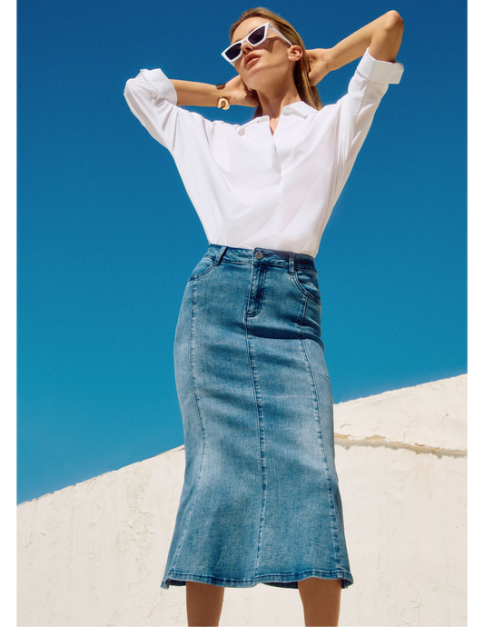 Hannahs Of Erin-Erin Ontario-Joseph Ribkoff A-line midi skirt-251952 made from premium denim, featuring intricate seam detailing, high-waist design, and a fly front with zipper closure. The skirt includes functional back pockets in a med denim blue, offering a flattering fit and versatility for casual occasions