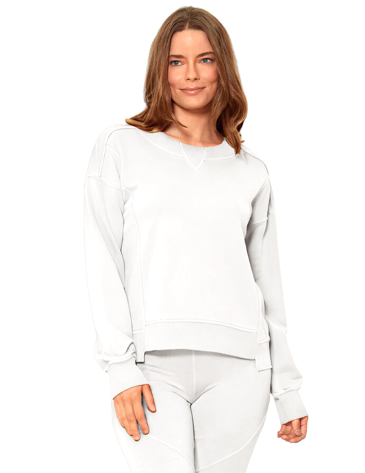 Hannahs_Of_Erin_-_Erin_Ontario-_Mod_o_Doc_-white_crop_sweatshirt-41E-11177-White. A chic cropped long-sleeve sweatshirt featuring a stylish "Dorito" inset design, crafted from ultra-soft cashmere French terry. Made with 100% cotton, this cozy pullover offers a flattering cropped silhouette, high-low hemline, perfect for pairing with high-waisted jeans, joggers, or skirts for a trendy and versatile look.