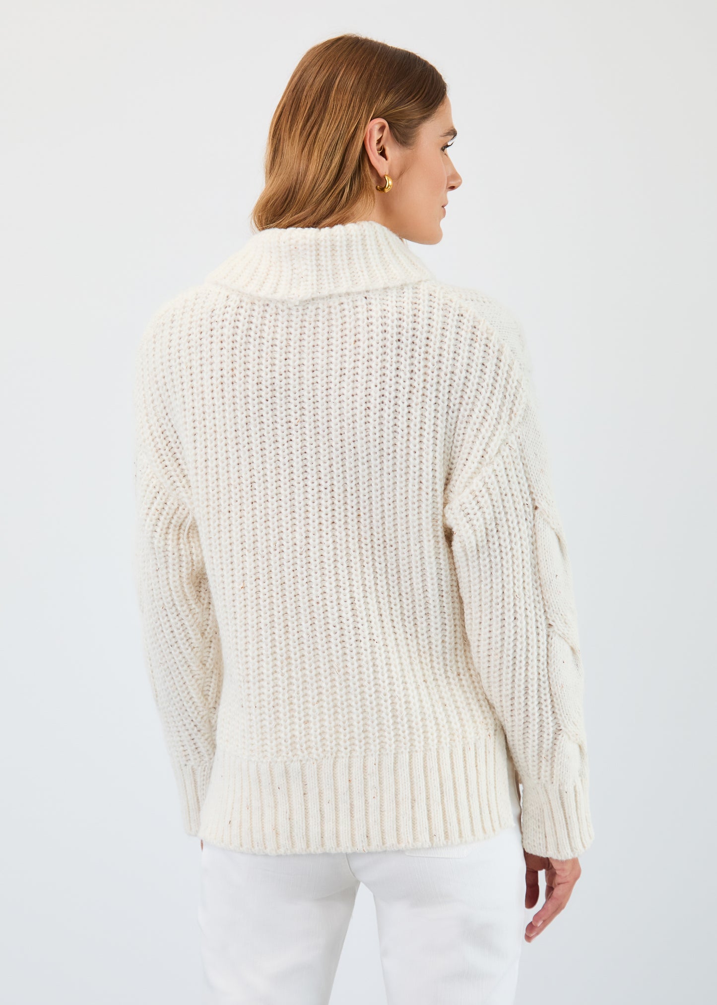 Hannahs Of Erin | Erin Ontario | FDJ | Cream Cable Cowl Neck Sweater. French Dressing Jeans Cream Cable Cowl Neck Sweater crafted from 100% polyester, featuring a luxuriously soft cable knit design, elegant draped cowl neckline, and flattering feminine silhouette, perfect for refined autumn and winter styling.