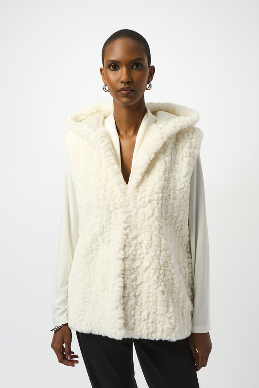 Hannahs Of Erin| Erin Ontario | Joseph Ribkoff | Faux Fur Textured Stripe Vest| colour Vanilla. Joseph Ribkoff sleeveless faux fur vest with textured stripe pattern, hooded collar, discreet hook-and-eye closure, and full lining, offering plush warmth and sophisticated layering.