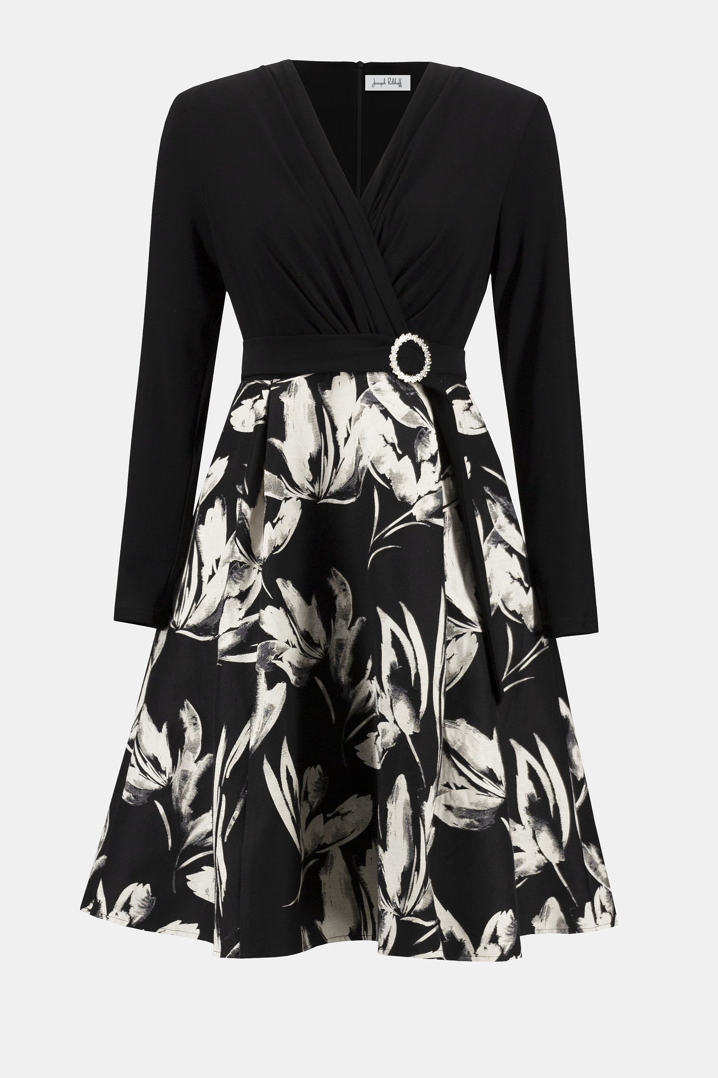Hannahs Of Erin| Erin Ontario | Joseph Ribkoff | Signature | Silky Knit Jacquard Floral Fit and Flare Dress
colour black/white
75% Cotton, 25% Polyester
Silky knit, jacquard fabric
Floral print skirt
V-shape wrap neckline
Long straight sleeves
Self-tie waist sash with rhinestone buckle
Shirring detail at waist
Pleating at skirt
Unlined