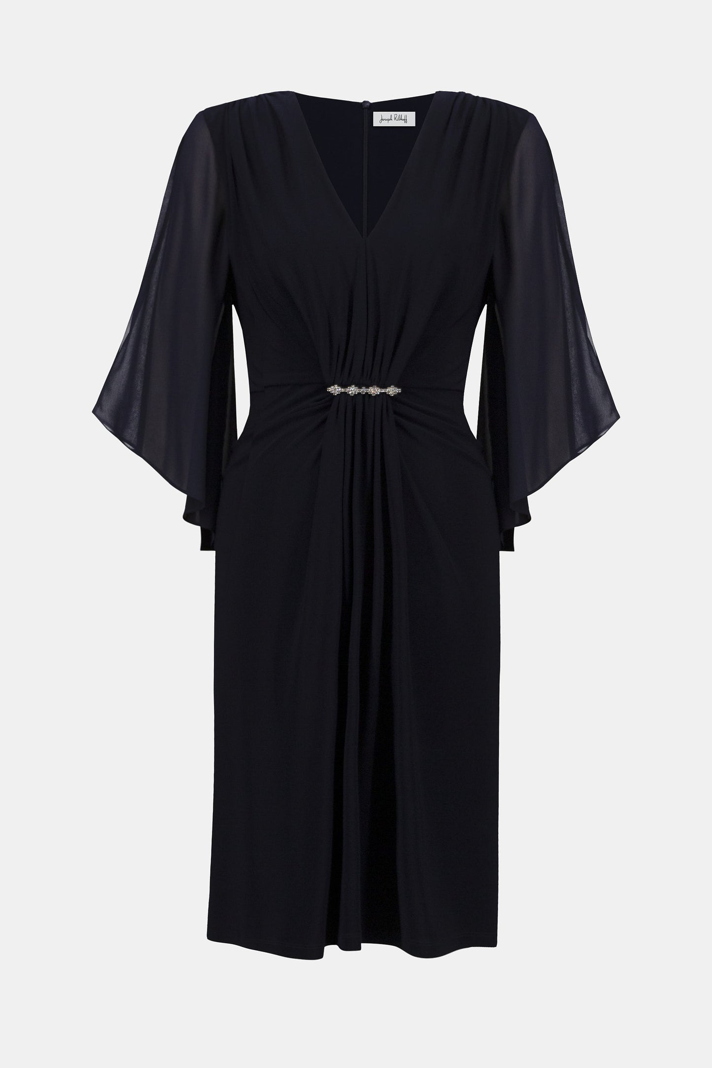 Hannahs Of Erin| Erin Ontario|Joseph Ribkoff Signature silky knit and chiffon sheath dress in midnight blue, featuring a V-neckline, three-quarter chiffon bell sleeves, delicate front draping, and a rhinestone ornament at the waist. Falls just below the knee and fully lined for a smooth, elegant fit, ideal for special occasions.