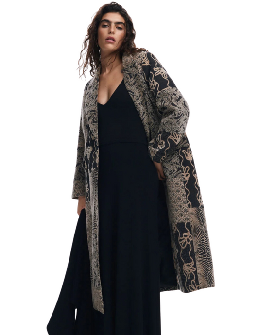 Hannahs Of Erin-ErinOntario-Desigual-Long patch coat-SKU 24WWEW601008 
Desigual Patch Coat with a mix of prints and patterns, long length, V-neck, button closure, and long sleeves. Features exterior pockets and is made from recycled polyester, cotton, and viscose for a stylish, eco-friendly, and durable outerwear option. Perfect as a statement piece for jackets, coats, or sustainable fashion