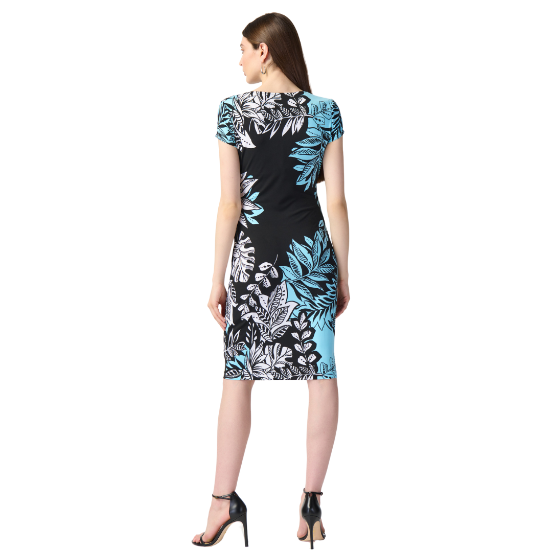 Hannahs Of Erin - Erin Ontario - Joseph Ribkoff Tropical Print Dress - 241287. Faux wrap with captivating tropical print. V neckline, short sleeves, subtle ruching, black, white, and soft turquoise hues, Knee-length for a balanced, versatile look Ideal for special occasions or daytime events, stretchy, pull on