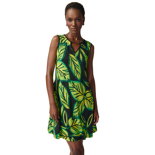 Hannahs Of Erin - Erin Ontario - Joseph Ribkoff's TUNIC DRESS 241119 is the ultimate summer vibe. Playful tropical leaf pattern for a vacation-ready look. Above-knee length adds a flirtatious touch, perfect for a fun and stylish atmosphere. Chic metal embellishment on the pointed neckline adds a touch of sophistication. Subtly flared silhouette for versatility, pairs well with strappy sandals or cute tennis shoes. Embrace the quirky design and experience the perfect blend of fun and style for summer.