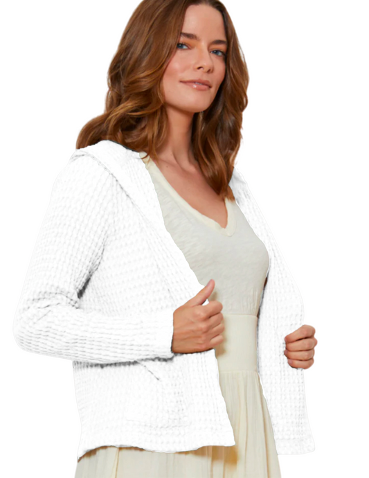 Hannahs_Of_Erin-ErinOntario-ModODoc-White_Crop_Cardi-41E-10491 A stylish Signature Waffle Hooded Open-Cardi made from 100% cotton, featuring a soft waffle texture, long sleeves, and a relaxed open-front design with a cozy hood. This versatile cropped cardigan includes functional patch pockets for convenience, making it perfect for layering over any outfit. Available in timeless colors like Raw Oats and Silver Grip, it’s ideal for casual outings or cozy nights in.