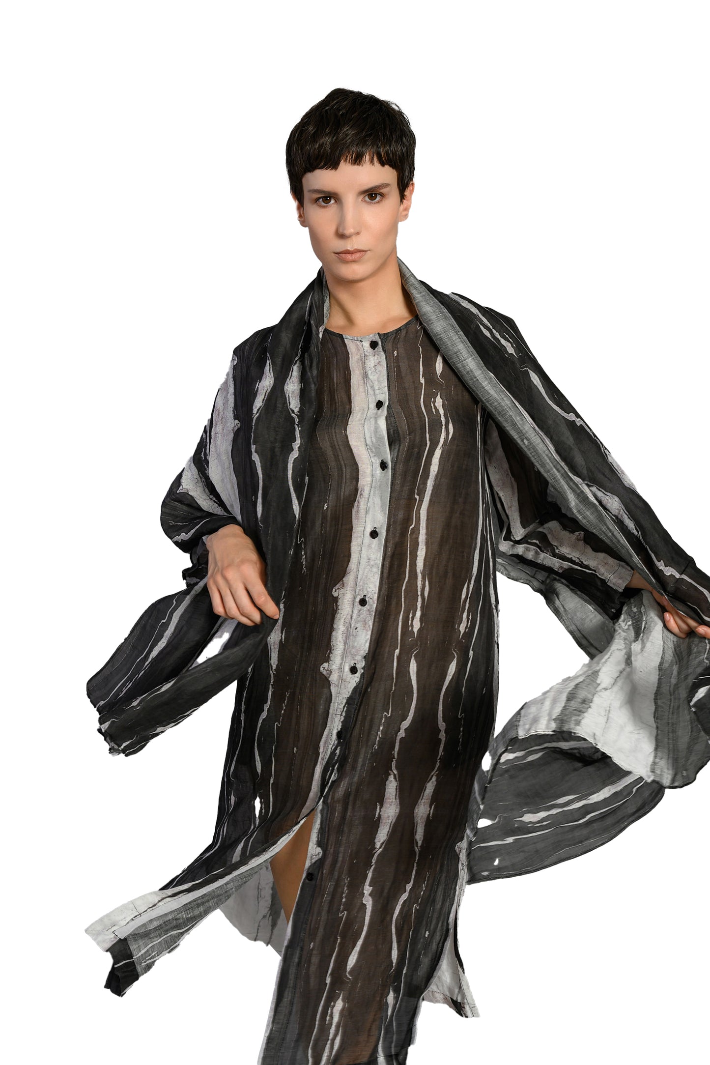 Hannahs Of Erin-Erin Ontario-Lotus Eaters-[19 LIZER] Linen-Blend Sheer Shirt Dress 
Black and white abstract stripe print

Long sleeves with a round neckline

Sheer, lightweight fabric with a relaxed silhouette

Button front closure for multiple styling options

Side slits for added ease and movement

FABRIC &amp; FIT

42% linen / 29% lyocell / 29% rayon

Airy and breathable with natural texture

Knee-length with a relaxed fit