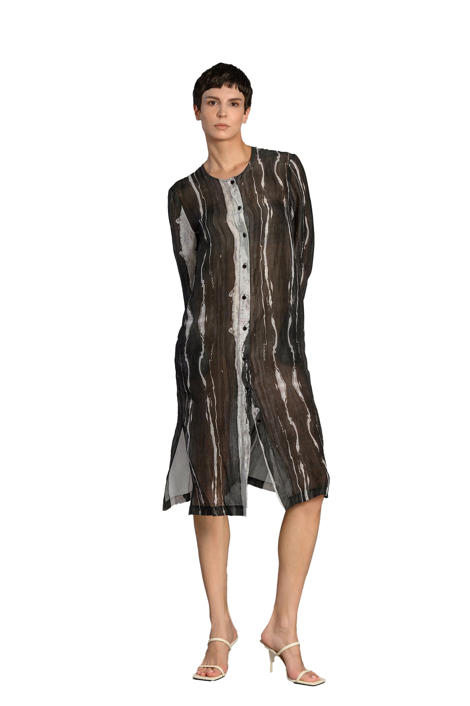 Hannahs Of Erin-Erin Ontario-Lotus Eaters-[19 LIZER] Linen-Blend Sheer Shirt Dress 
Black and white abstract stripe print

Long sleeves with a round neckline

Sheer, lightweight fabric with a relaxed silhouette

Button front closure for multiple styling options

Side slits for added ease and movement

FABRIC &amp; FIT

42% linen / 29% lyocell / 29% rayon

Airy and breathable with natural texture

Knee-length with a relaxed fit