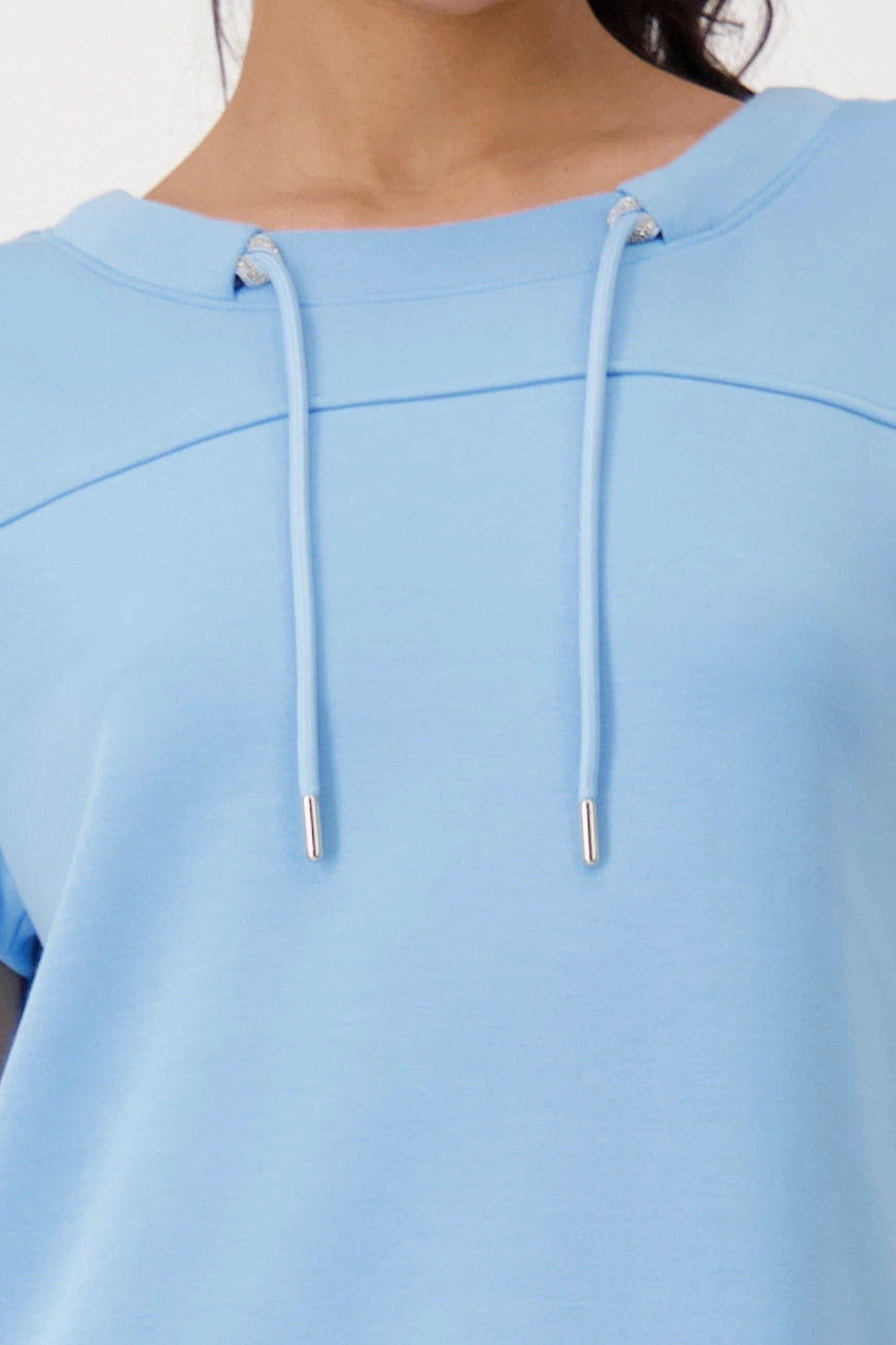 Hannahs_Of_Erin-Erin_Ontatio-Monari-S_S_BANU_SWEAT_SHIRT-Sky Blue. Monari soft-touch sweatshirt in stretch modal blend, featuring a stand-up collar with metal grommet drawstring, short dropped sleeves, and a relaxed silhouette