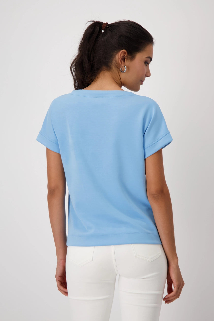 Hannahs_Of_Erin-Erin_Ontatio-Monari-S_S_BANU_SWEAT_SHIRT-Sky Blue. Monari soft-touch sweatshirt in stretch modal blend, featuring a stand-up collar with metal grommet drawstring, short dropped sleeves, and a relaxed silhouette