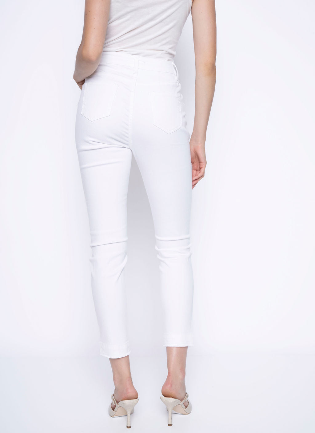 Hannahs Of Erin- Erin Ontario-Picadilly- White frayed edge denim jeans, slim-leg fit, high-waisted design, tummy control, zip closure, belt loops, frayed ankle hems, ankle-length cut, 98% cotton, 2% spandex, soft and breathable fabric, 5-pocket styling, fly front, modern edge, casual or chic style, versatile wear, perfect for casual outings or dressing up with heels, contemporary design, flattering and comfortable fit, high rise, made with high-quality materials for durability and style.
