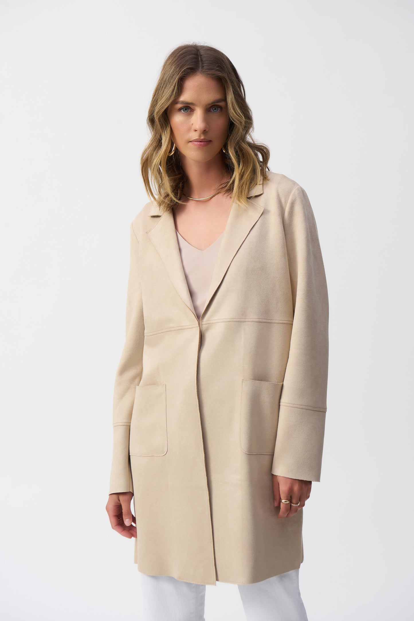 .Hannahs_Of_Erin-_Erin_Ontario-_Joseph_Ribkoff-_Single-Breasted_Overcoat-_Parchment_-251941, mid-length overcoat featuring a notched lapel, straight long sleeves, and practical front pockets. Designed for a regular fit, this minimalist coat is crafted from 95% polyester and 5% spandex, offering a polished, timeless style perfect for formal, office, or semi-formal occasions