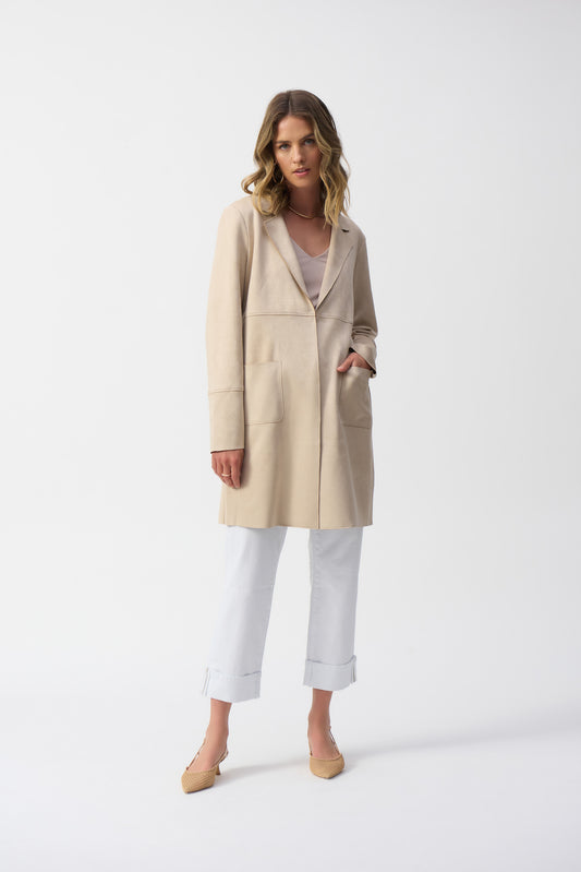 Joseph Ribkoff single-breasted, mid-length overcoat featuring a notched lapel, straight long sleeves, and practical front pockets. Designed for a regular fit, this minimalist coat is crafted from 95% polyester and 5% spandex, offering a polished, timeless style perfect for formal, office, or semi-formal occasions