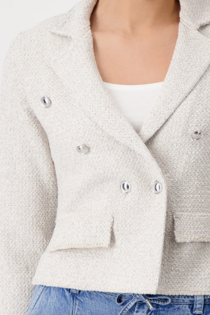 Hannahs Of Erin - Erin Ontario- Monari- Soft White -Elegant tweed knitted blazer-409479 in viscose blend with shimmering lurex, featuring lapel collar, long sleeves, button placket, faux flap pockets, and elongated front hem. Slightly fitted silhouette with decorative buttons and woven texture.

