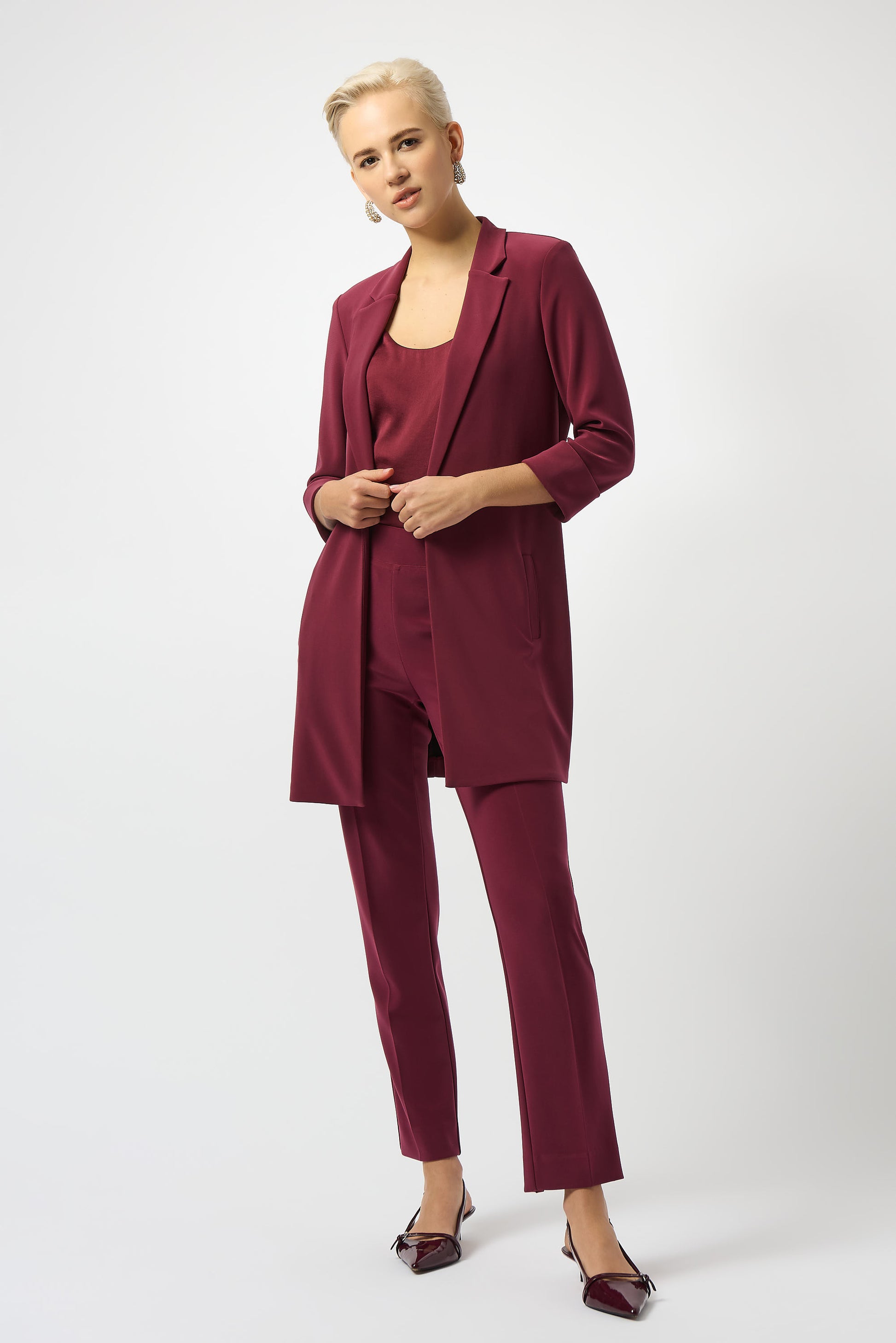 Hannahs Of Erin | Erin Ontario |Joseph Ribkoff |Classic Straight Pant-Merlot.Joseph Ribkoff Classic Straight Pant in rich Merlot, pull-on design with covered elastic waistband, silky knit fabric, straight-leg silhouette, and discreet back hem slits for ease of movement. Unlined and lightweight for versatile day-to-night wear

