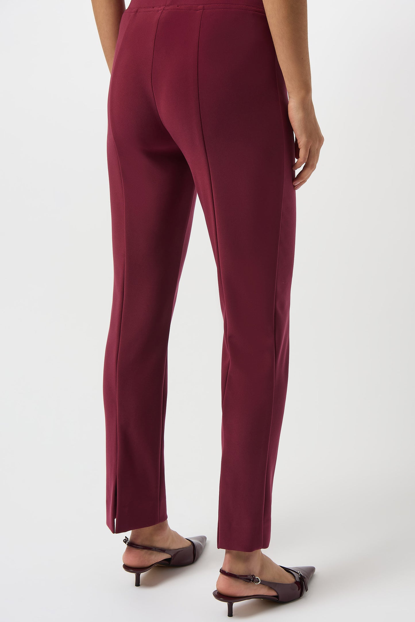Hannahs Of Erin | Erin Ontario |Joseph Ribkoff |Classic Straight Pant-Merlot.Joseph Ribkoff Classic Straight Pant in rich Merlot, pull-on design with covered elastic waistband, silky knit fabric, straight-leg silhouette, and discreet back hem slits for ease of movement. Unlined and lightweight for versatile day-to-night wear

