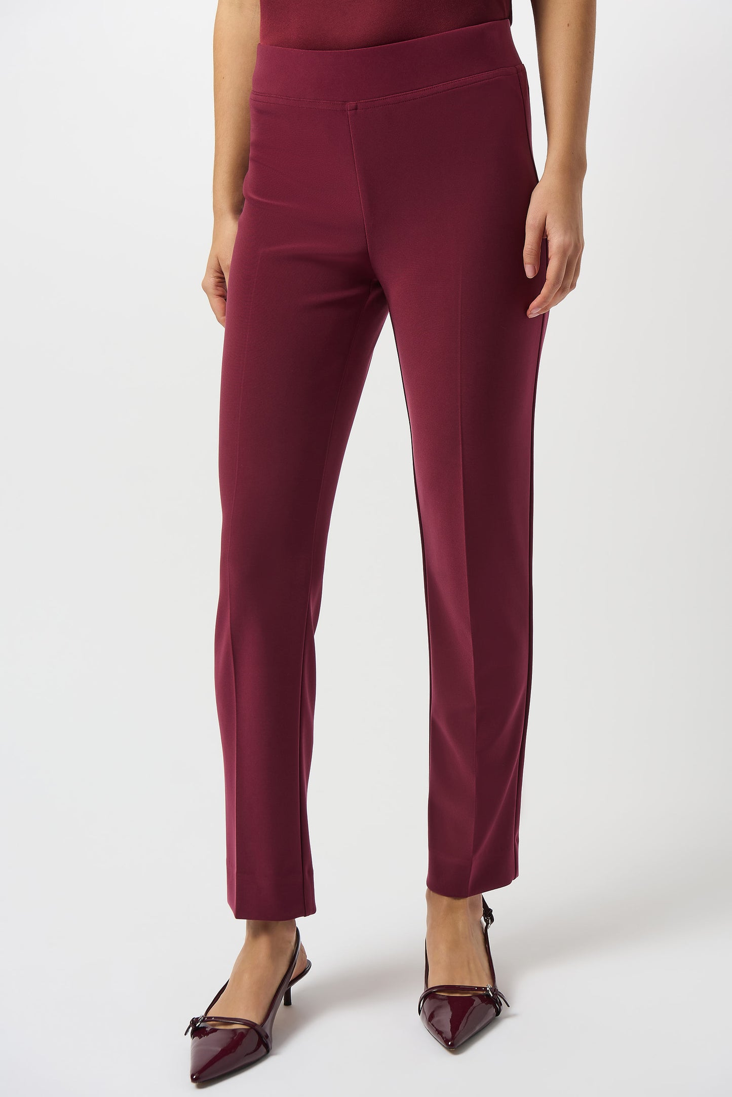 Hannahs Of Erin | Erin Ontario |Joseph Ribkoff |Classic Straight Pant-Merlot.Joseph Ribkoff Classic Straight Pant in rich Merlot, pull-on design with covered elastic waistband, silky knit fabric, straight-leg silhouette, and discreet back hem slits for ease of movement. Unlined and lightweight for versatile day-to-night wear

