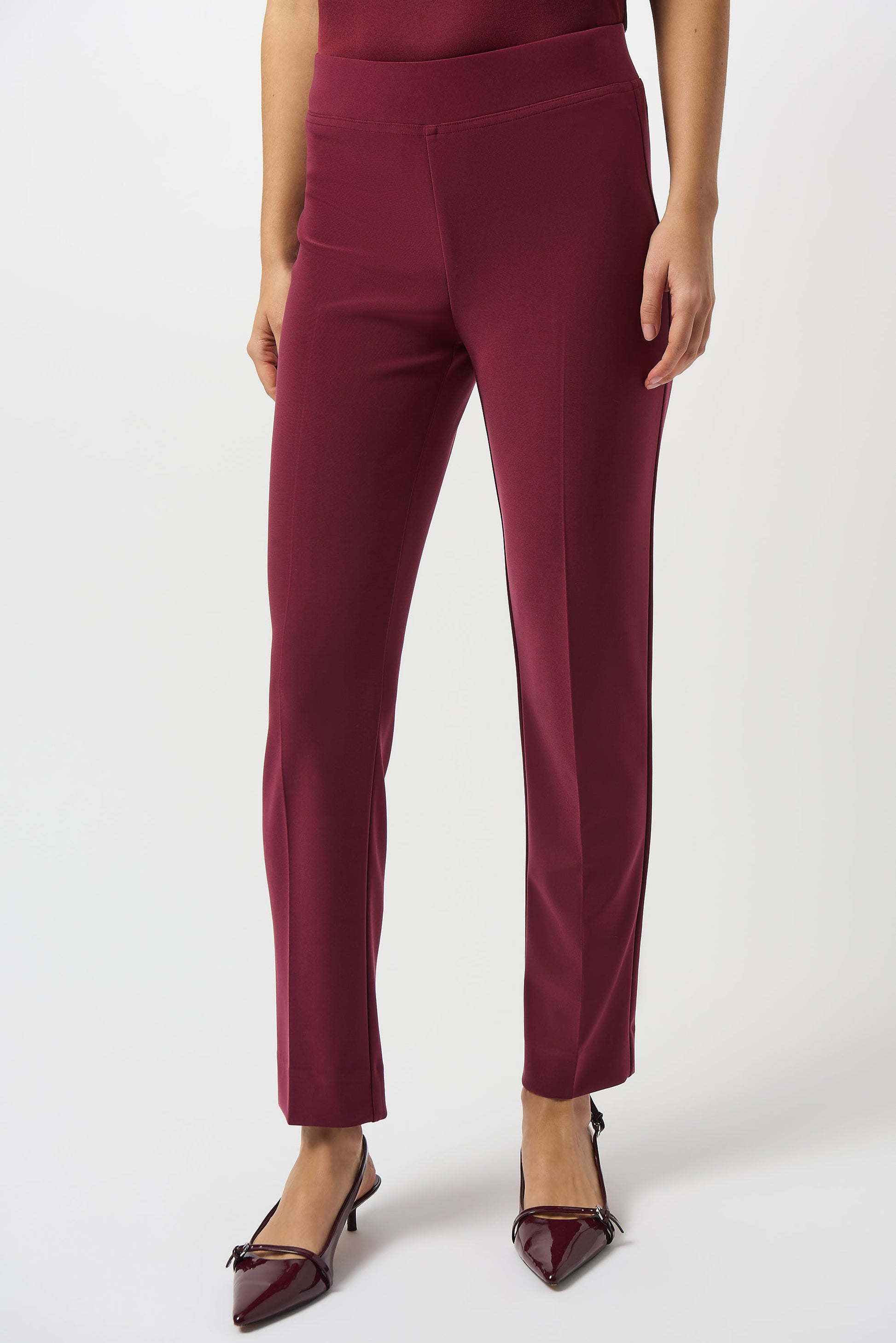 Hannahs Of Erin | Erin Ontario |Joseph Ribkoff |Classic Straight Pant-Merlot.Joseph Ribkoff Classic Straight Pant in rich Merlot, pull-on design with covered elastic waistband, silky knit fabric, straight-leg silhouette, and discreet back hem slits for ease of movement. Unlined and lightweight for versatile day-to-night wear

