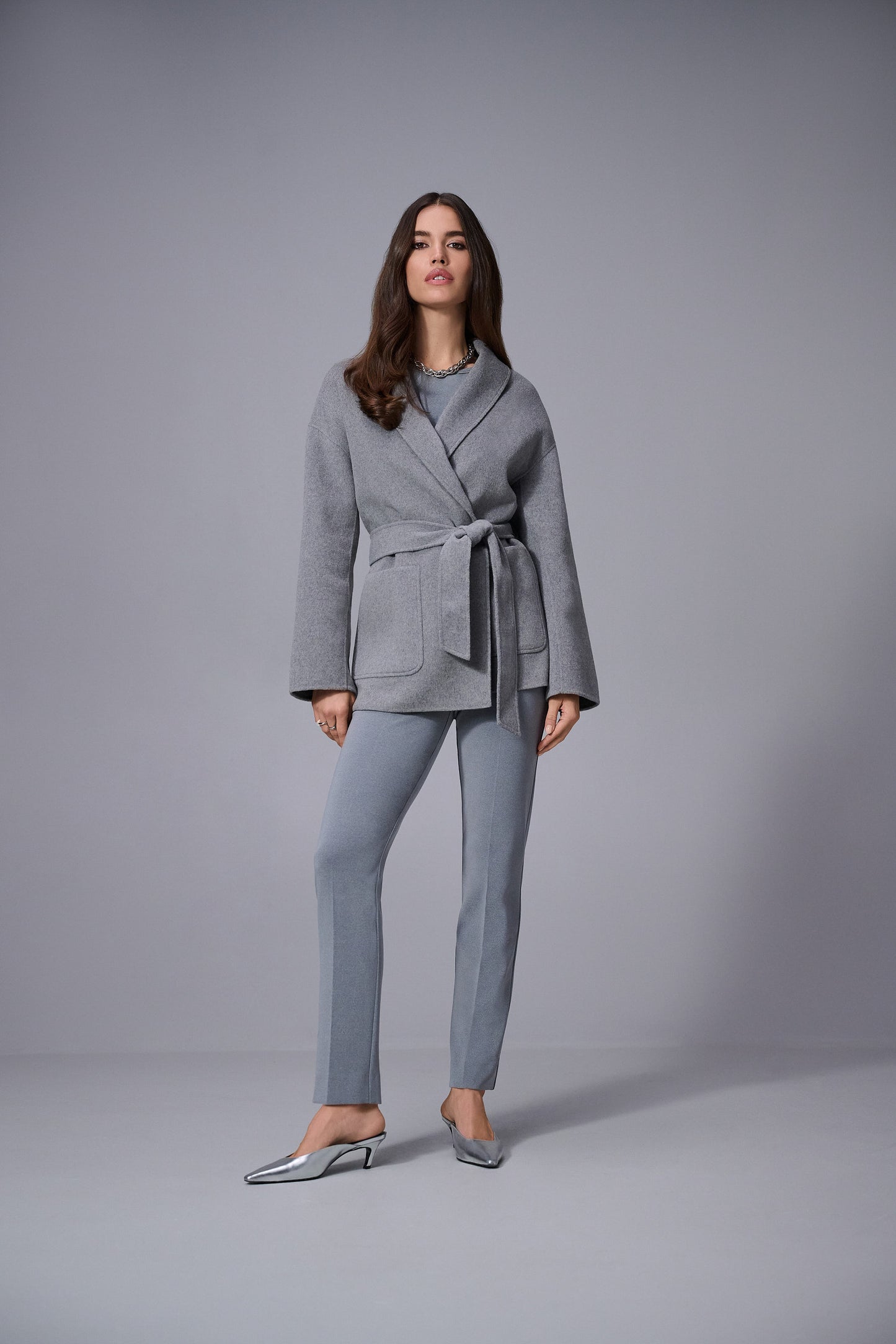Hannahs Of Erin | Erin Ontario | Joseph Ribkoff | Melange Silky Knit Straight Leg Pull-On Pants. Colour Gray. Ribkoff melange silky knit straight leg pull-on pants in bonded fabric with covered elastic waistband and back slit detail, designed for a flattering and comfortable office-ready fit.

