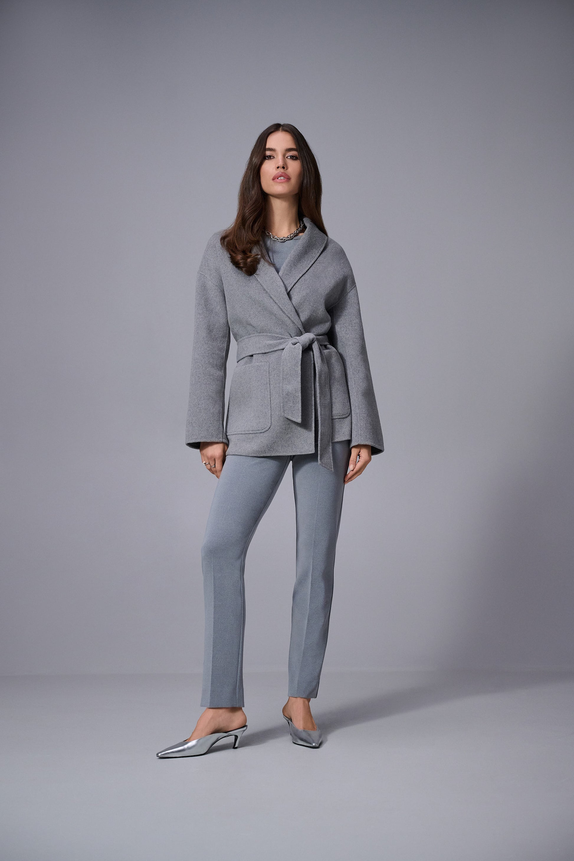 Hannahs Of Erin | Erin Ontario | Joseph Ribkoff | Melange Silky Knit Straight Leg Pull-On Pants. Colour Gray. Ribkoff melange silky knit straight leg pull-on pants in bonded fabric with covered elastic waistband and back slit detail, designed for a flattering and comfortable office-ready fit.

