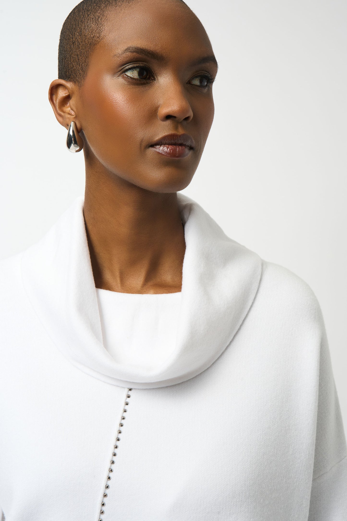 Hannahs Of Erin | Erin Ontario| Joseph Ribkoff | Sweater Knit Asymmetrical Pullover. Colour Vanilla 
25% Polyester, 25% Polyamide, 50% Viscose rayon
Sweater knit
Cowl neck
Long straight sleeves
Iron-on detailing
Unlined
