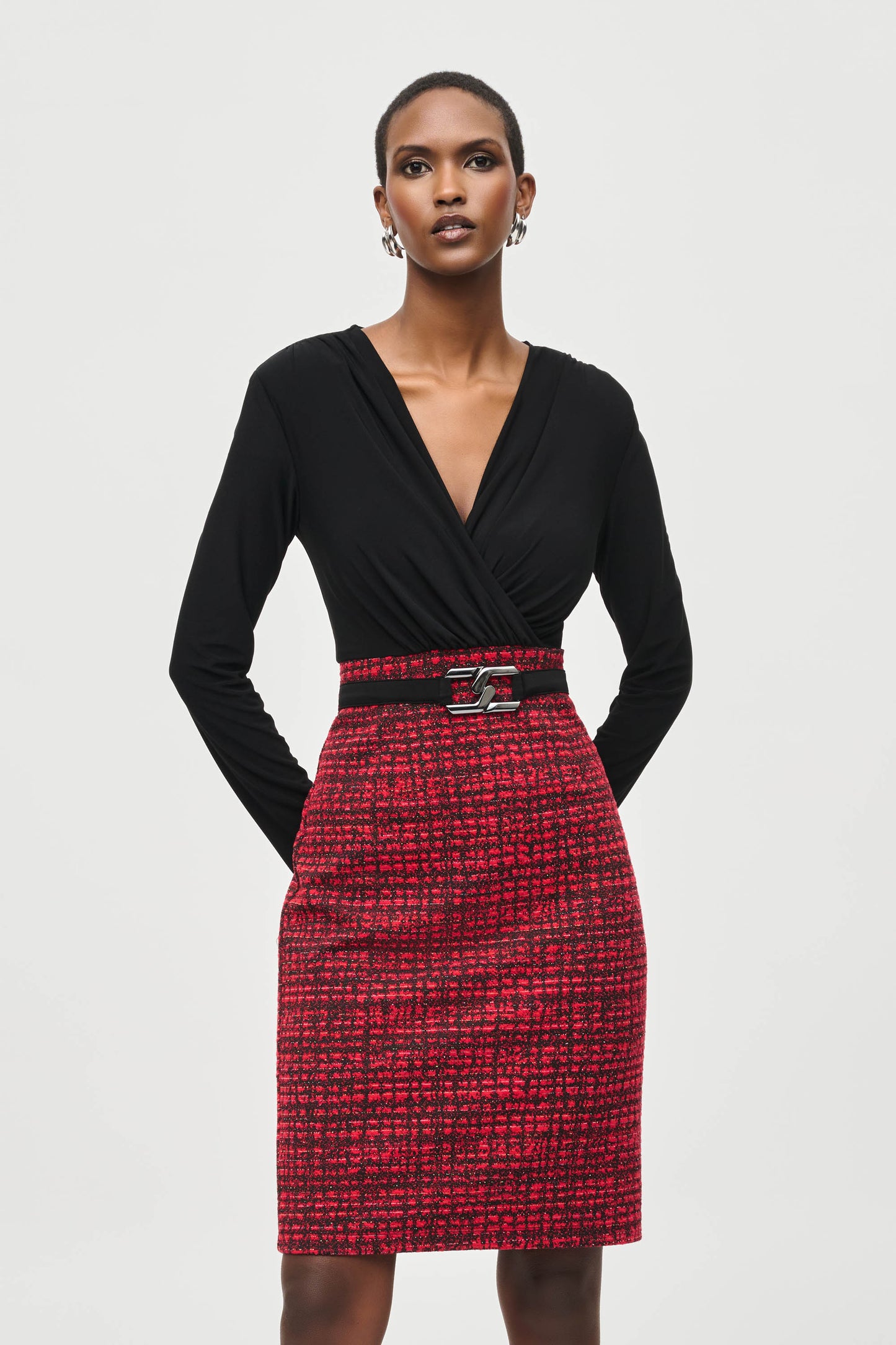 Hannahs of Erin- Erin Ontario-Joseph Ribkoff dress-243060. Long straight sleeves, featuring an red/black subtle plaid abstract patterned mini pencil skirt and wraparound silhouette bodice with a belt. Made from a blend of polyester and spandex for a comfortable fit, and complete with a back zipper. Ideal for semi-formal occasions or a stylish night out. Knee length.