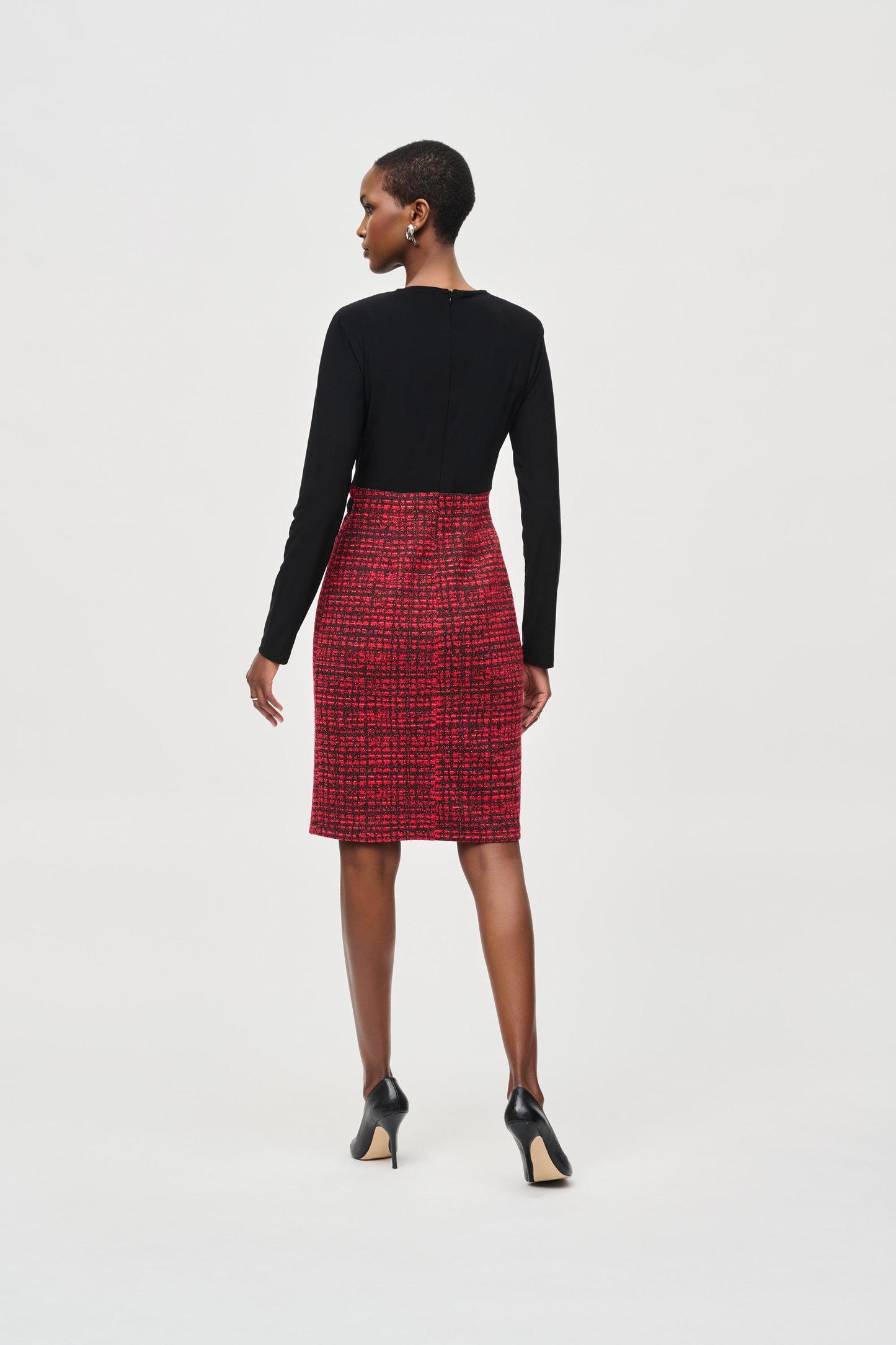 Hannahs of Erin- Erin Ontario-Joseph Ribkoff dress-243060. Long straight sleeves, featuring an red/black subtle plaid abstract patterned mini pencil skirt and black wraparound silhouette bodice with a belt. Made from a blend of polyester and spandex for a comfortable fit, and complete with a back zipper. Ideal for semi-formal occasions or a stylish night out. Knee length.