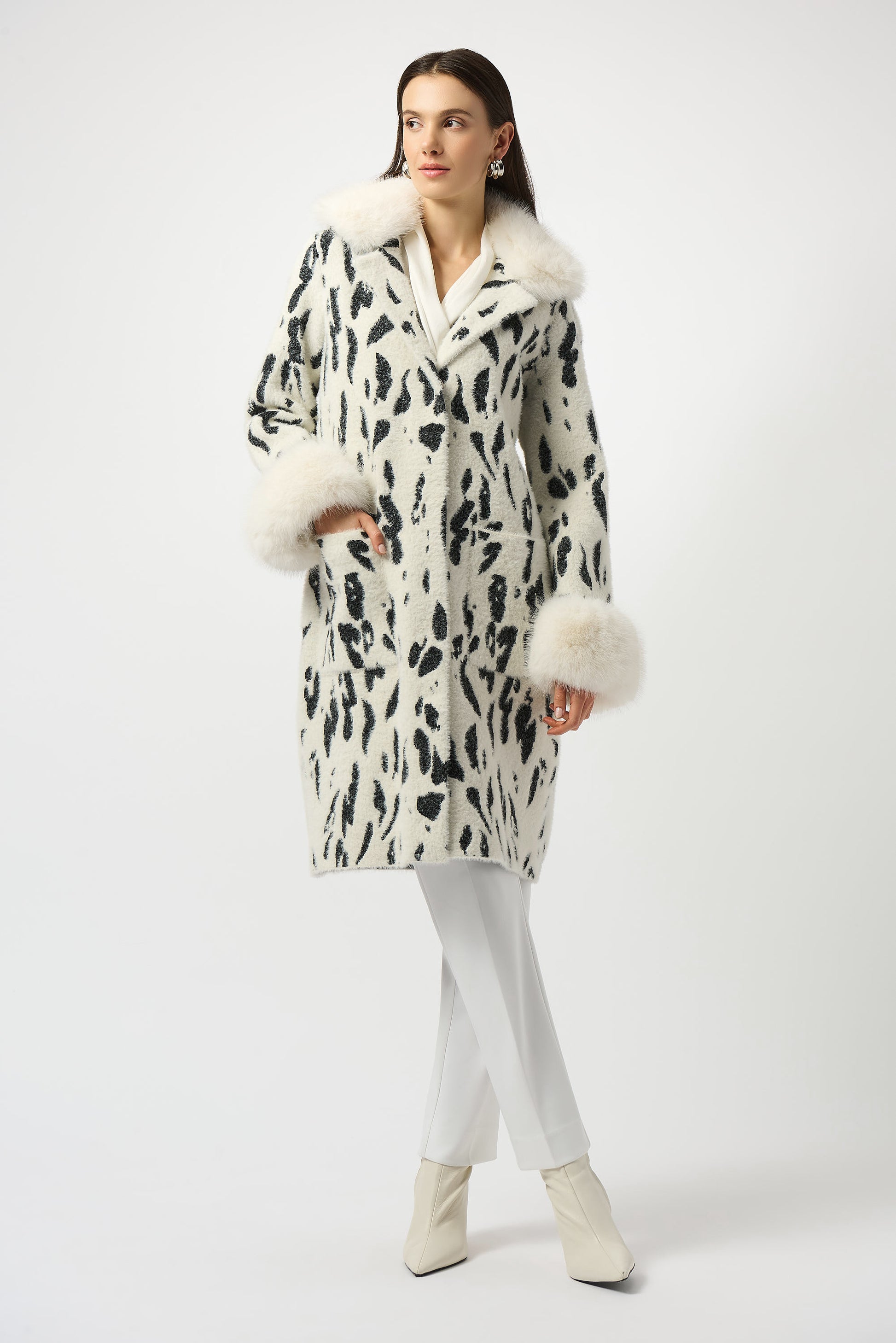 Joseph Ribkoff | Feather Yarn Animal Jacquard Coat with Faux Fur Trim| colour Winter White/Black
67% Nylon, 33% Polyester
Feather yarn sweater knit and faux fur
Animal print
Notched collar with faux fur trim
Long straight sleeves with faux fur cuffs
Unlined