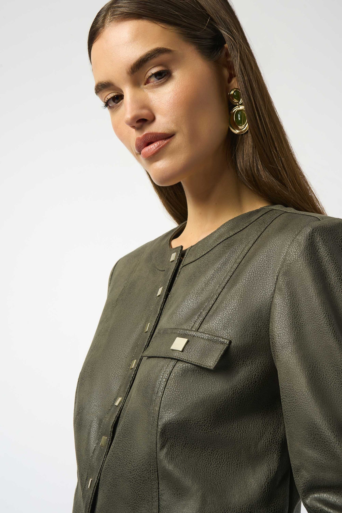 Joseph Ribkoff | Foiled Faux Suede Fitted Jacket | colour Avocado
90% Polyester, 10% Spandex
Foiled stretch faux suede
Crew neck
Long straight sleeves
Self tabs at cuffs
Square snap button front closure
Flap pockets with snap buttons
Unlined

