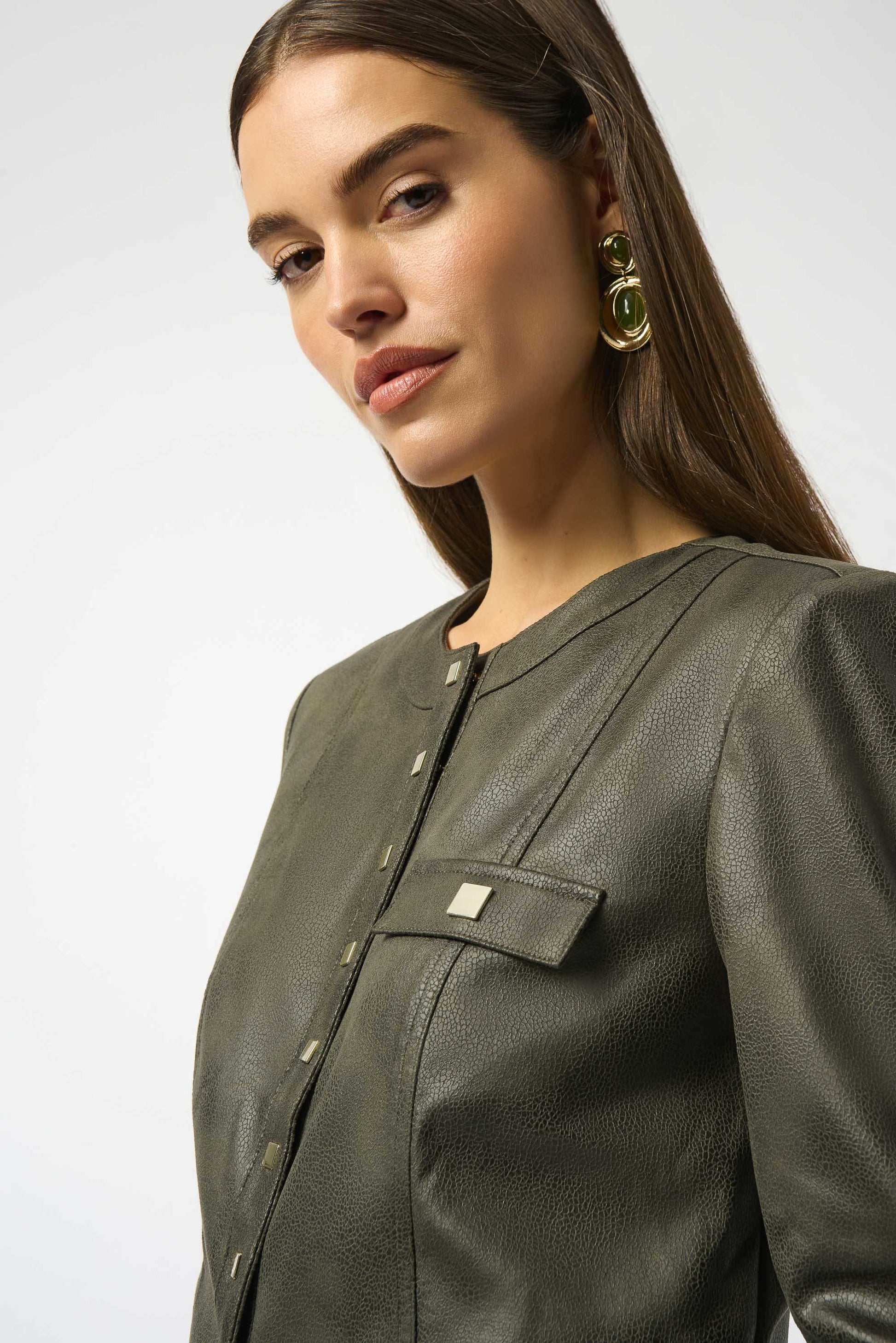 Joseph Ribkoff | Foiled Faux Suede Fitted Jacket | colour Avocado
90% Polyester, 10% Spandex
Foiled stretch faux suede
Crew neck
Long straight sleeves
Self tabs at cuffs
Square snap button front closure
Flap pockets with snap buttons
Unlined

